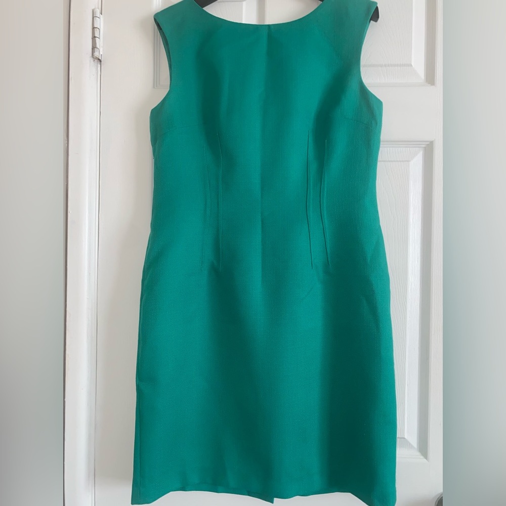 Green dress size 10 with stitching in the front zipper up in the back